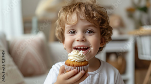 Young boy eating a cupcake 