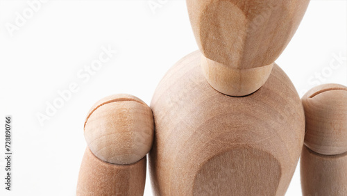 Closeup of a wooden mannequin isolated on white background. (ID: 728890766)