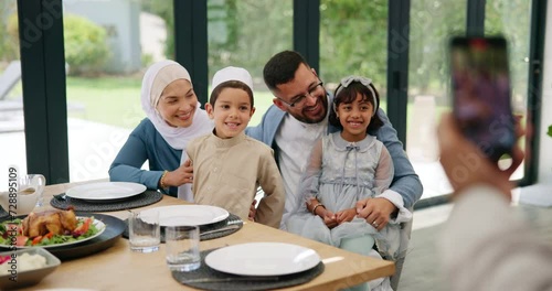 Islamic, photograph or happy family in home at lunch with smile or celebration of Eid or Ramadan in Dubai. Muslim child, people eating food or profile picture at dinner meal with parents, dad or mom photo