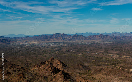 Road going into small city Quartzsite, Az and the mountains and desert photo