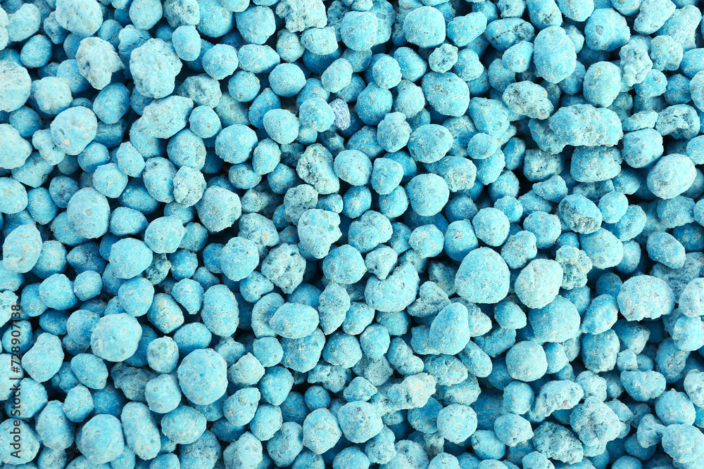 Closeup view of blue granular fertilizer as background Closeup view of blue granular fertilizer as background