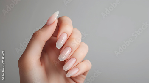 Elegant Nude Manicure on Graceful Hand, Beauty and Care, Nail Salon Ad photo