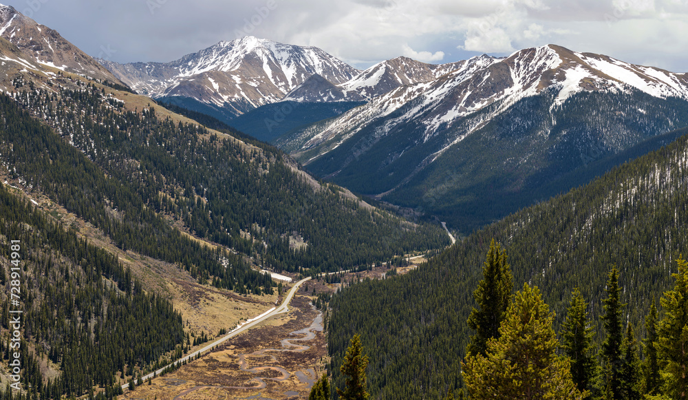 Spring Mountains - Panoramic view of Highway 82 winding in Lake Creek Valley, with snow-capped La Plata Peak (14,336 ft) of Sawatch Range towering in background, as seen from Independence Pass. CO, US