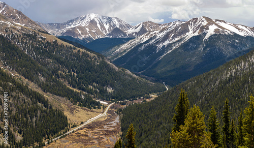 Spring Mountains - Panoramic view of Highway 82 winding in Lake Creek Valley, with snow-capped La Plata Peak (14,336 ft) of Sawatch Range towering in background, as seen from Independence Pass. CO, US