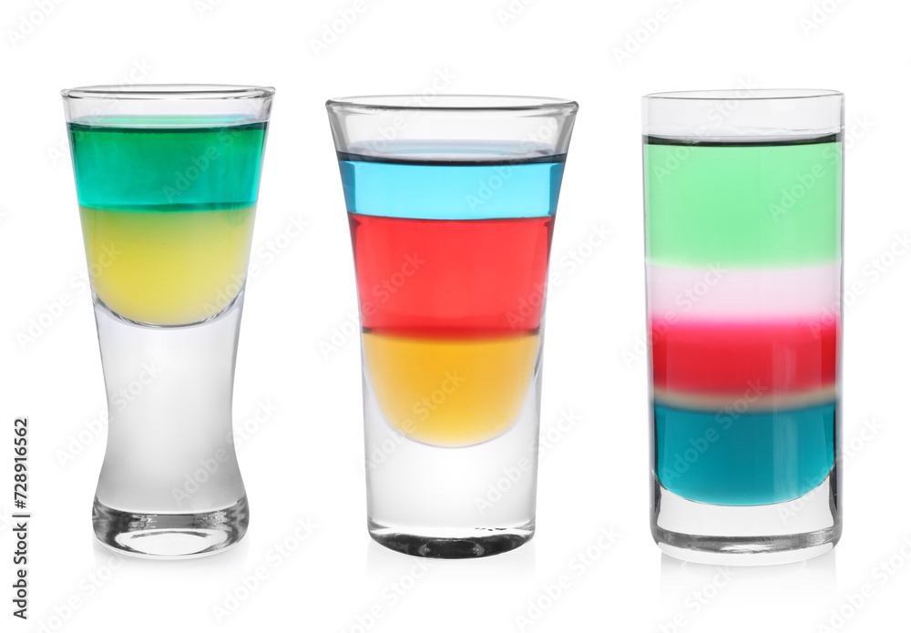 Different shooters in shot glasses isolated on white, set Different shooters in shot glasses isolated on white, set