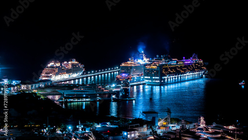 Beautiful scenic aerial night view cruise ships docked on the Caribbean island of St Maarten. Cruise travel vacation. photo