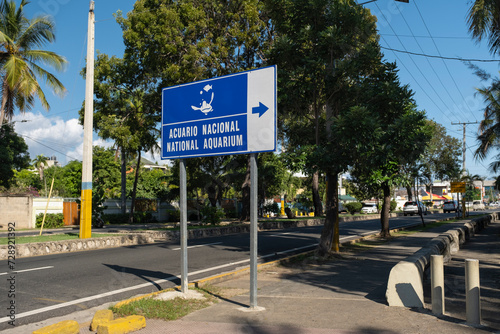 Outdoor sign National Aquarium in Spanish and English languages in Santo Domingo, Dominican Republic.