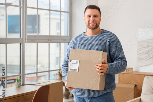 Young man with open parcel ...