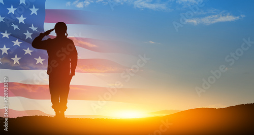 Tableau sur toile Silhouette of soldier saluting on background of USA flag
