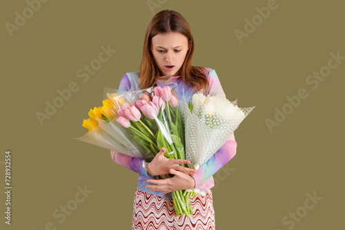 Young woman with bouquets o...