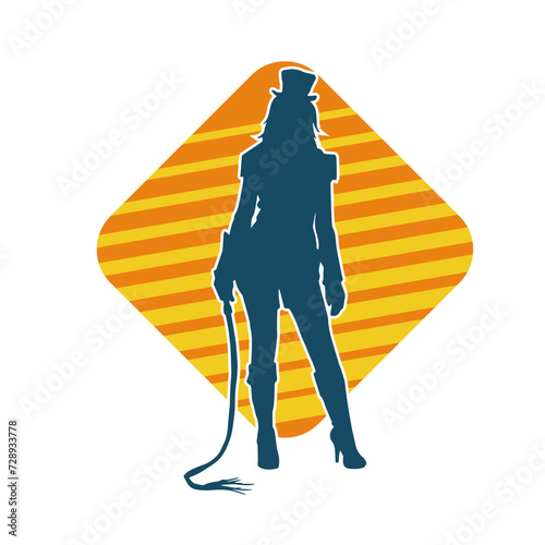 Silhouette of a slim female model wearing sexy fancy tight costume in pose carrying whip 
