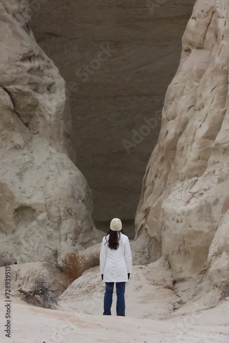 Girl in front of natural cave