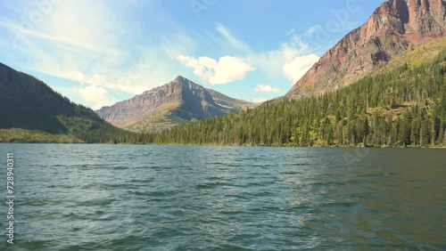 Sinopah Mountain viewed by boat during the day in Glacier National Park photo