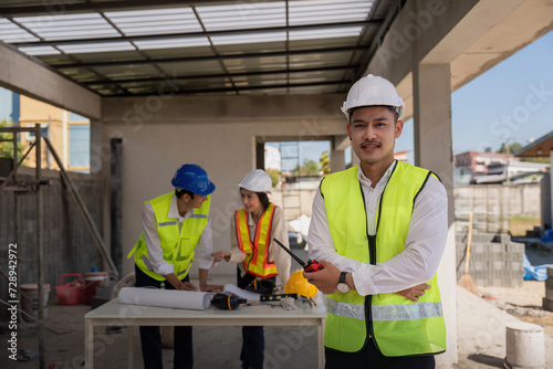 Happy of team construction worker. engineer, construction site and team outdoor for building project © Natee Meepian