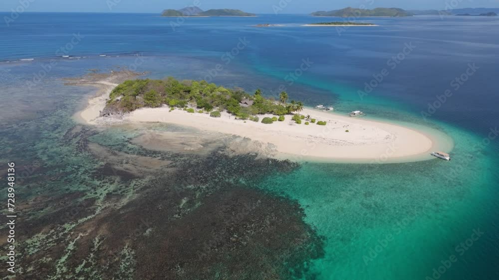Aerial view of tropical island with white sand beach and crystal clear blue water in the Philippines. Tropical island Aerial view of tropical island with white sand beach and crystal clear blue water in the Philippines. Tropical island