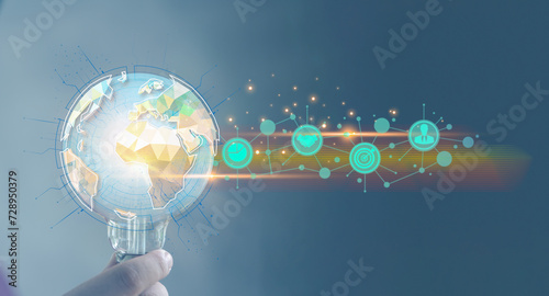 Fototapeta Naklejka Na Ścianę i Meble -  Male hand holding light bulb with globe with business icons. Global ideas and creativity