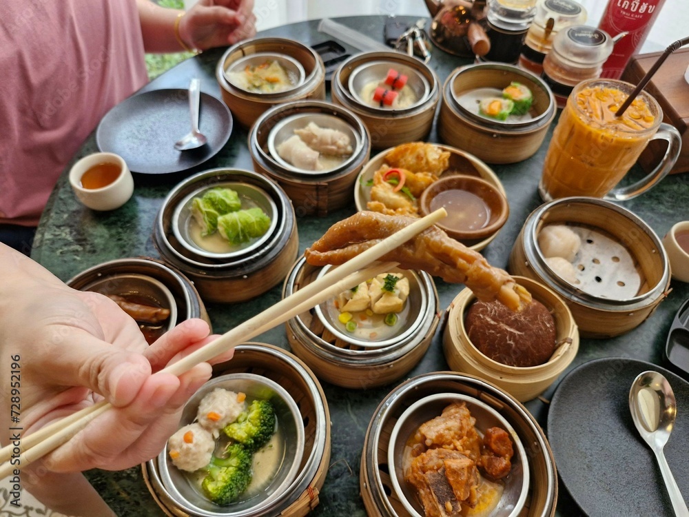 food in the restaurant Top view of dim sum, a popular Asian breakfast dish. food in the restaurant Top view of dim sum, a popular Asian breakfast dish.