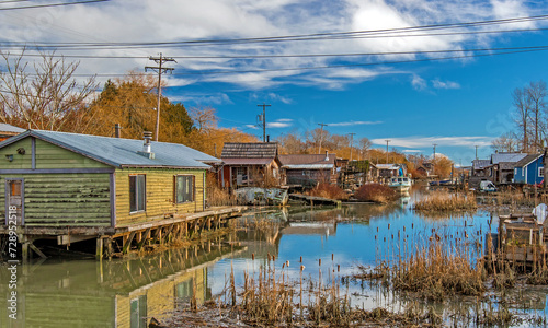 Finn Slough Panorama. Motorbot at Fishermen Village. The historic fishing settlement of Finn Slough on the banks of the Fraser River in Richmond, British Columbia, Canada