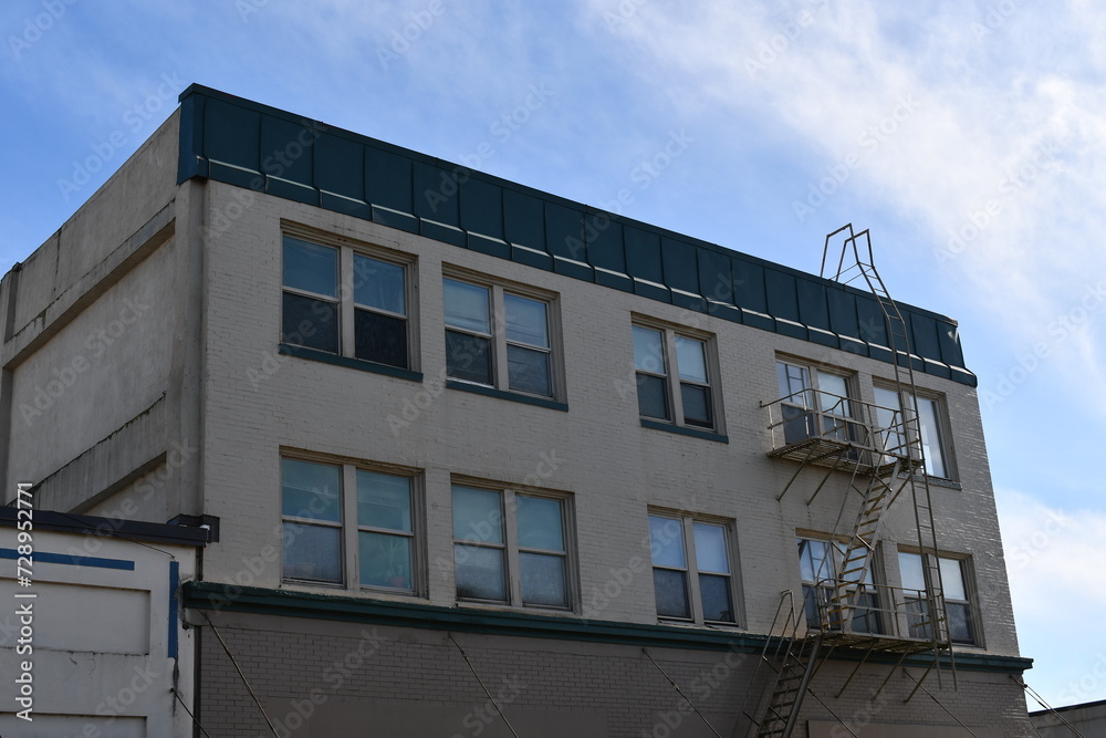 Apartment building with fire escape. Apartment building with fire escape.
