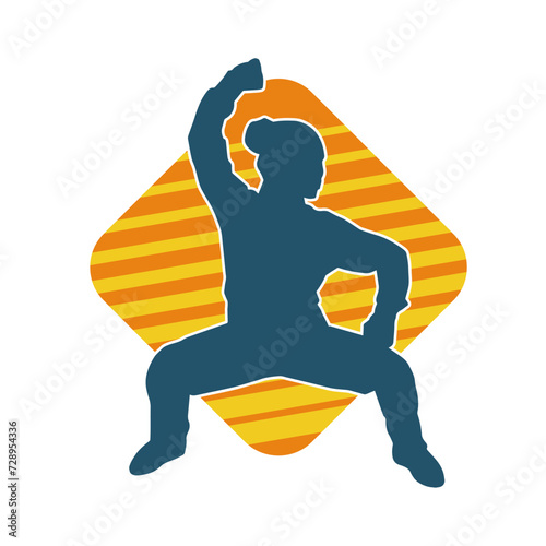 Silhouette of a slim female doing martial art pose. Silhouette of a martial art woman in action pose.