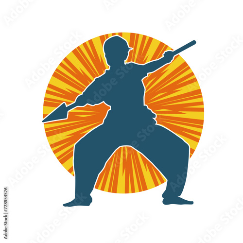 Silhouette of a wushu martial artist in action pose with a spear weapon. Silhouette of a fighter carrying a spear weapon.