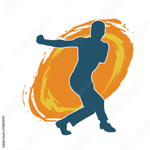 Silhouette of a man in oriental martial art pose. Silhouette of a male in martial art move.