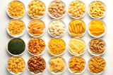 set of different types of italian pasta and spaghetti on white background.  top view
