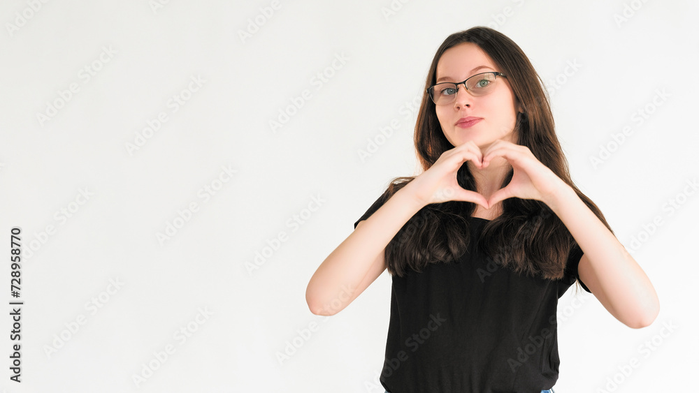 Love gesture. Romantic affection. Like admiration. Smiling woman showing hand heart sign blowing isolated on white empty space background. Love gesture. Romantic affection. Like admiration. Smiling woman showing hand heart sign blowing isolated on white empty space background.