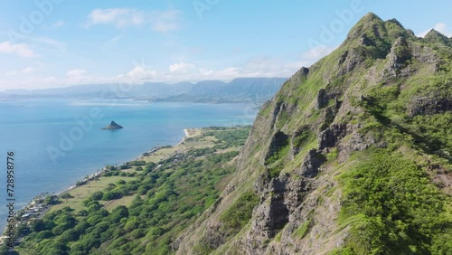 Wallpaper Mural Breathtaking aerial view on dramatic mountains, blue ocean, Oahu island Hawaii. Beautiful nature drone flying along high green jungle mountain peaks with tropical beach at Kualoa ranch valley panorama Torontodigital.ca