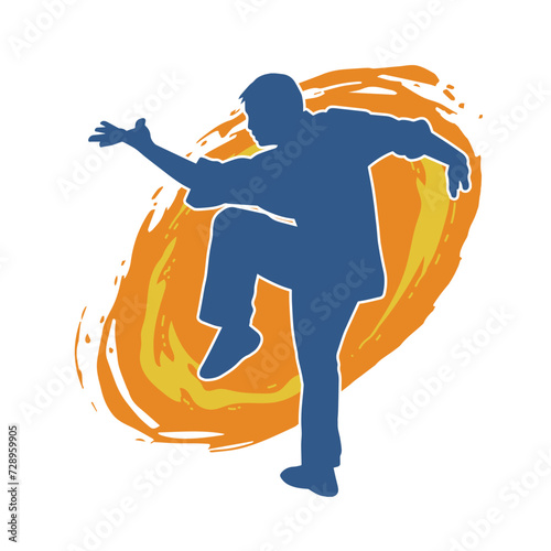 Silhouette of a man in oriental martial art pose. Silhouette of a male in martial art move.