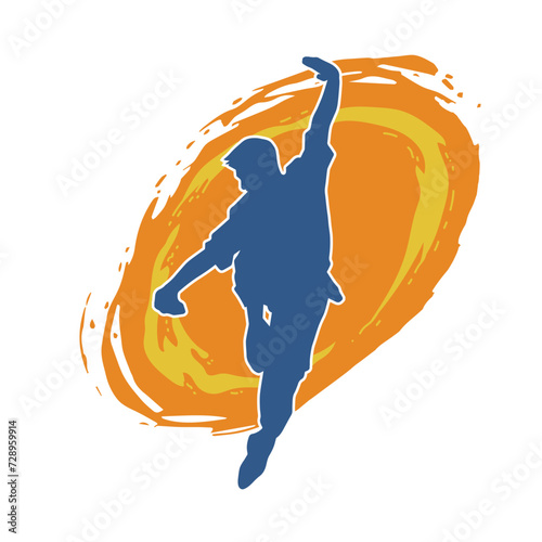 Silhouette of a man in oriental martial art pose. Silhouette of a male in martial art move.