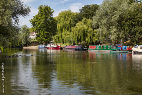 A narrowboats and houseboats on the river Cam. Cambridge. Cambridgeshire. United Kingdom