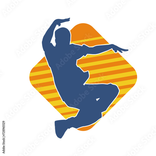 Silhouette of a male dancer in performing pose. Silhouette of a dancing man.