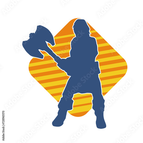 Silhouette of a sexy female warrior in battle armor carrying axe weapon