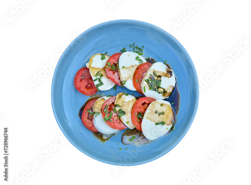 Delicious caprese salad with ripe tomatoes and mozzarella cheese on white background