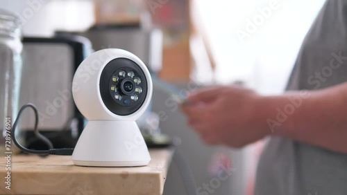The people use smartphone to control ip camera works by panning and scan for detect. Home security and protection concept photo