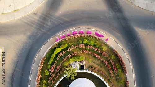Aerial tilt-up view from fountain of arch 22 entrance of Banjul city, Gambia with I love Banjul letters photo