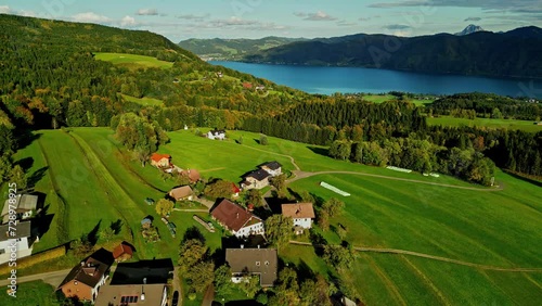 Aerial view of Austrian countryside with Lake Atter in the background, sunlight over the valley photo