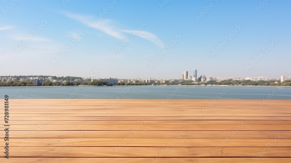 The empty wooden table top with a blurred background of the lake and the city