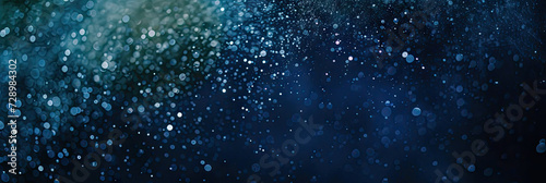 a blue and gold background with stars. Suitable for celestial, festive, or glamorous design projects such as invitations, holiday-themed graphics.glitter lights. de focused. banner.bokeh blur circle