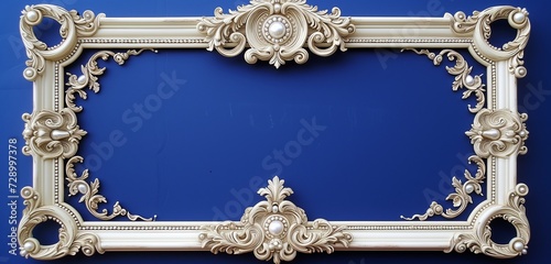 A richly decorated ivory baroque frame with pearl inlays on a royal blue backdrop