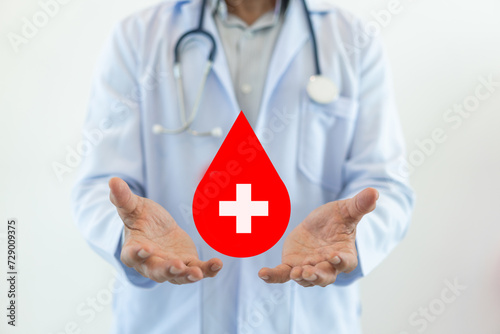 Doctor hand holding blood drop donation, save life, world hemophilia day concept, world blood donor day, hospital, save life and health insurance, world mental health day