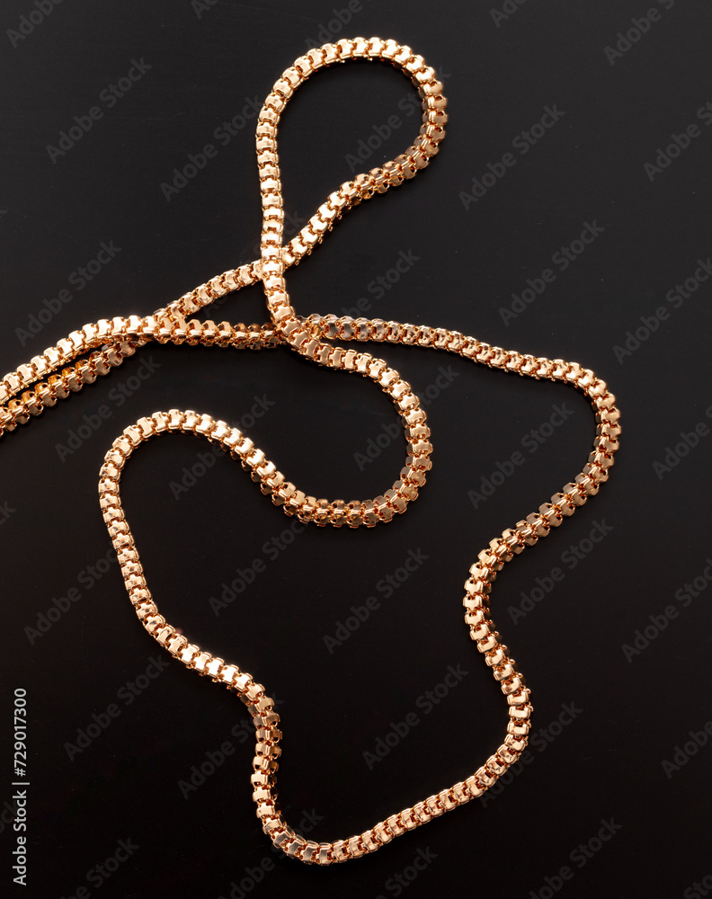 Gold chain isolated on black background. Close-up Gold chain isolated on black background. Close-up