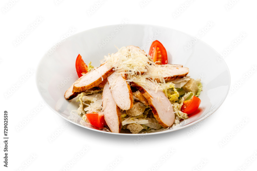 Caesar salad with chicken in a white plate. Isolated. Caesar salad with chicken in a white plate. Isolated.