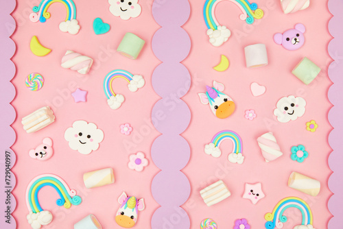 Trendy pastel pink kawaii background with cute air plasticine handmade cartoon animals, unicorns, stars, sweet marshmallows, rainbows pattern. Top view, flat lay. Candycore, fairycore.