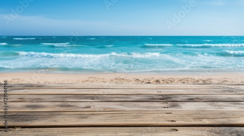 Wooden table is set on the tropical beach, offering views of the endless blue sky and sea.