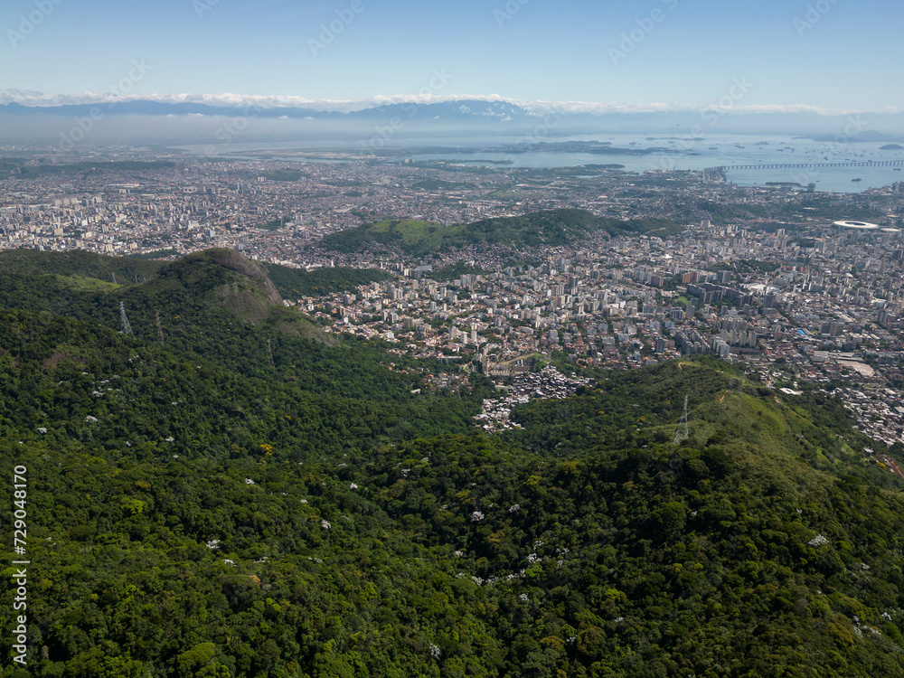 Fototapeta premium Beautiful aerial view to green rainforest mountains and city