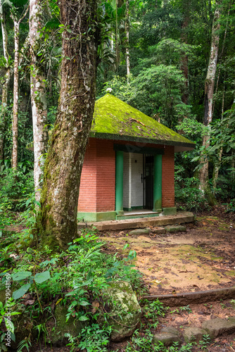 Small bathroom hut in green rainforest area, Tijuca National Park