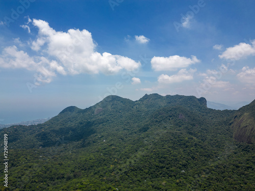 Beautiful aerial view to green rocky rainforest mountains in Tijuca