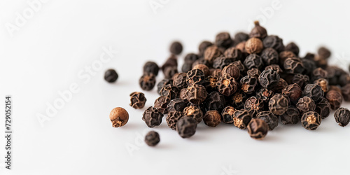 The Close-up Photo of Black Peppercorns with a Focus on Their Textured Surfaces, Scattered Across a White Background. This Photo Could be Used to Showcase Spices in Culinary Articles, etc.